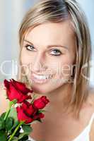 Portrait of a smiling woman holding roses