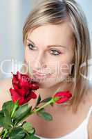 Portrait of a cute woman holding roses