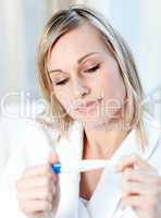 Beautiful woman finding out the results of a pregnancy test