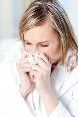 Sick woman blowing