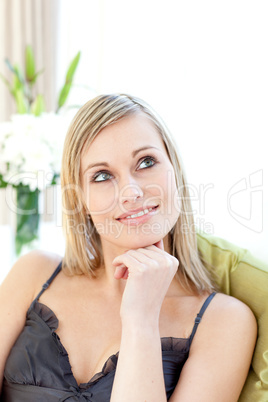 Radiant woman sitting on a sofa