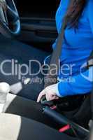 Close-up of caucasian woman putting seat belt