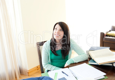 Young woman studying sitting at a table