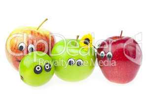 apple and lime with eyes isolated on white