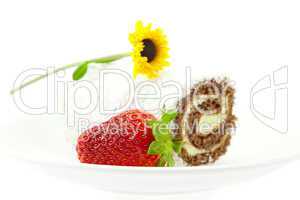 cake and strawberries with flower isolated on white