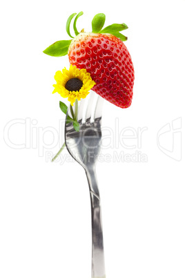 strawberry and flower on a fork isolated on white