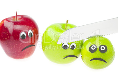comic still life of apples and limes with eyes isolated on white