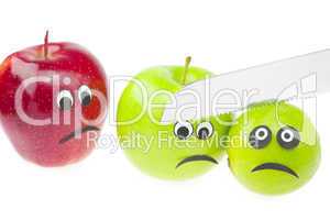 comic still life of apples and limes with eyes isolated on white