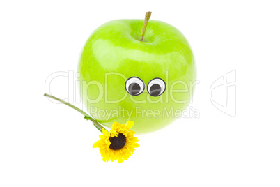 apple with eyes and a flower isolated on white