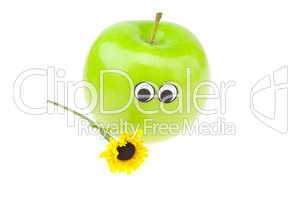 apple with eyes and a flower isolated on white