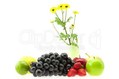 apple, strawberry, lemon, lime, grapes and flowers isolated on w