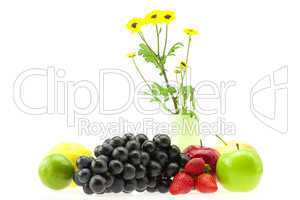 apple, strawberry, lemon, lime, grapes and flowers isolated on w