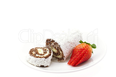 strawberries and roll on a plate isolated on white