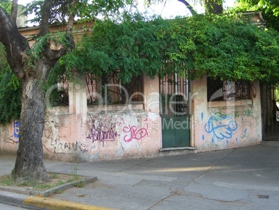 pink house with graffiti