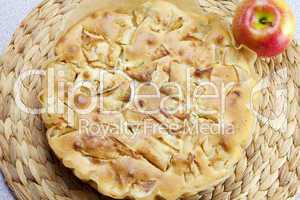 home apple pie and apple on a wicker mat