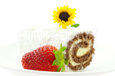 roll, strawberries and a flower isolated on white