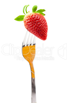 Strawberry on fork isolated on white