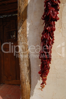 dried peppers against doorway