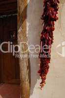 dried peppers against doorway