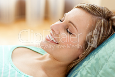 Beautiful woman lying on sofa