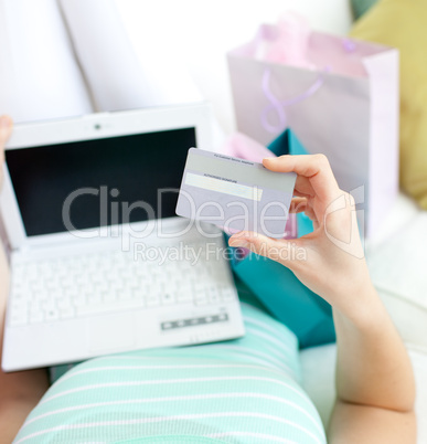 Close-up of a woman shopping on-line at home