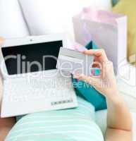 Close-up of a woman shopping on-line at home