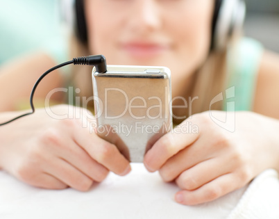 Close-up of a young woman listening music