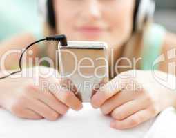 Close-up of a young woman listening music