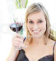 Bright woman drinking red wine
