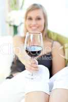 Radiant woman drinking red wine