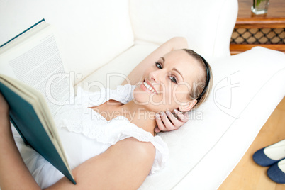Attractive woman reading a book