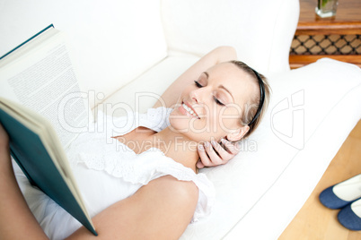 Radiant woman reading a book