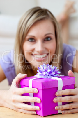 Smiling woman holding a gift