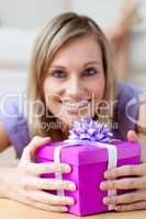 Smiling woman holding a gift