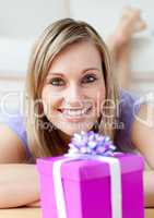 Cheerful woman looking at a gift
