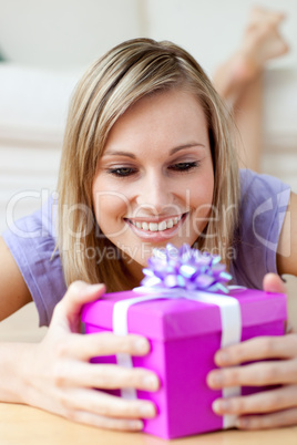 Jolly woman holding a gift