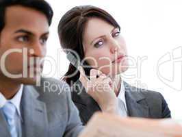 Beautiful businesswoman on phone in a waiting room