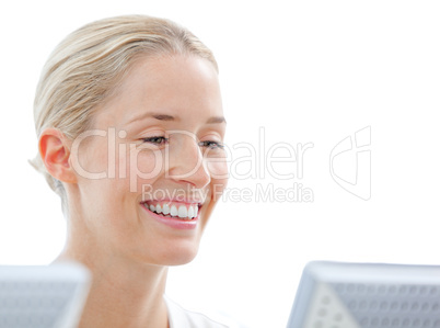 Positive businesswoman working at a computer