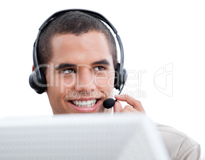 Attractive businessman with headset on working