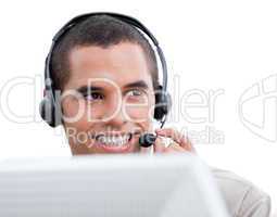 Attractive businessman with headset on working