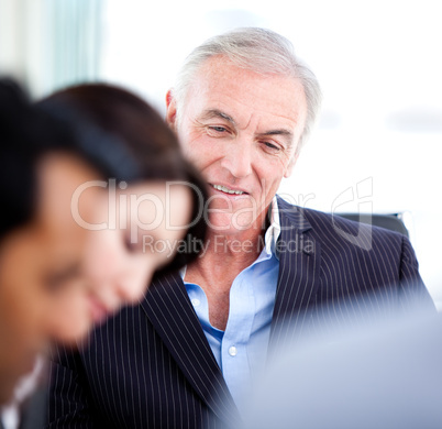 Confident senior businessman in a meeting