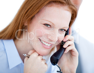 Positive businesswoman taling on phone