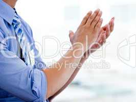 Close-up of a businessman clapping