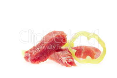 Juicy slices of pork and pepper isolated on white