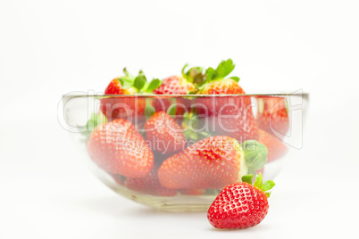 juicy strawberries in a bowl isolated on white