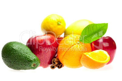 avocado, apple, orange, lemon, and cinnamon, isolated on white