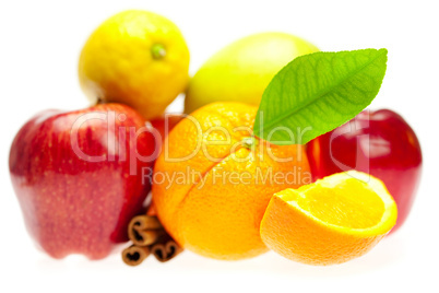 apple, orange, lemon and cinnamon, isolated on white