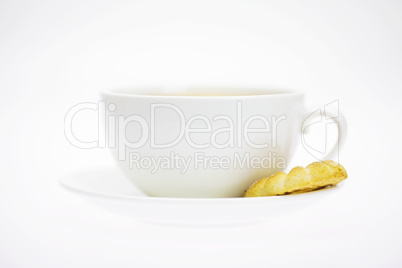 white cup and pastry isolated on white