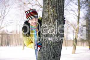 Teen girl with snowball, surprised