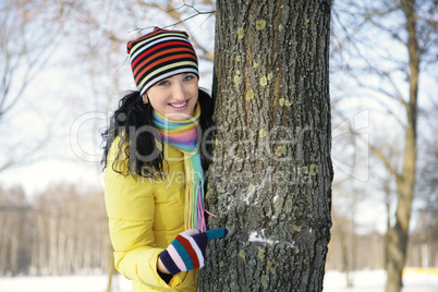 Teen girl with snowball, surprised